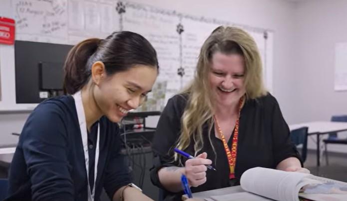 Two women discussing lessons